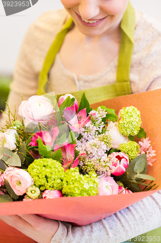 Image of close up of woman with bunch at flower shop