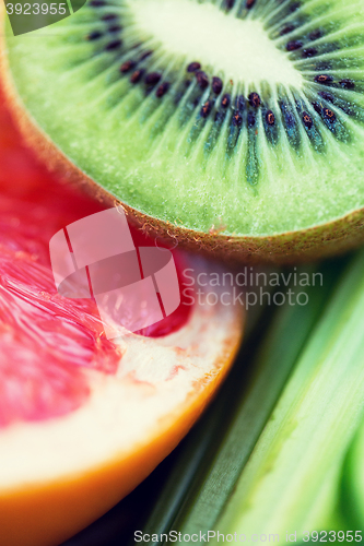 Image of close up of ripe kiwi and grapefruit slices