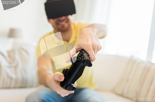 Image of close up of man in virtual reality headset playing