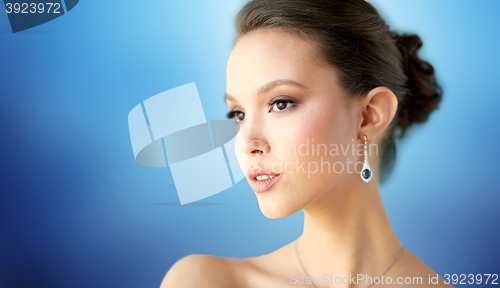 Image of close up of beautiful woman face with earring