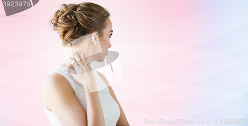 Image of close up of beautiful woman with ring and earring