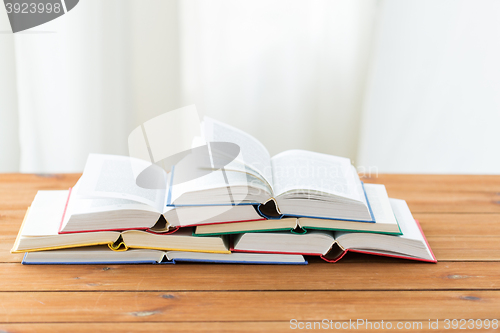 Image of close up of books on wooden table