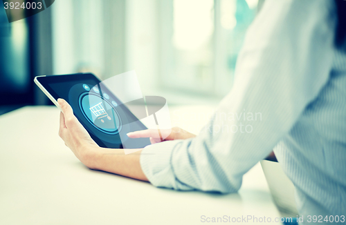 Image of close up of woman hands with tablet pc at office