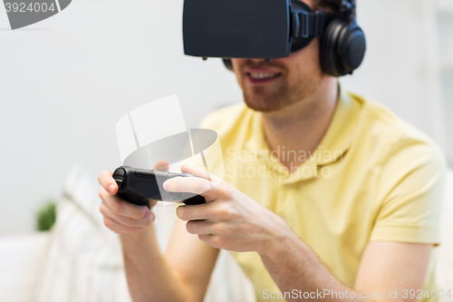 Image of close up of man in virtual reality headset playing