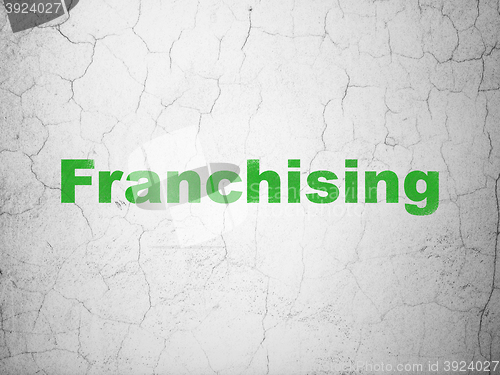 Image of Business concept: Franchising on wall background