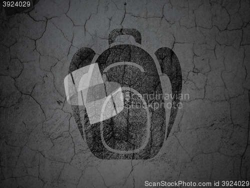 Image of Vacation concept: Backpack on grunge wall background
