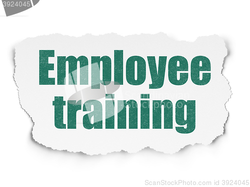 Image of Learning concept: Employee Training on Torn Paper background