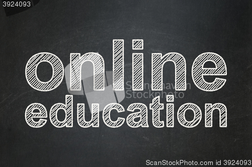 Image of Studying concept: Online Education on chalkboard background