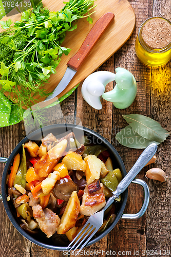 Image of fried meat with vegetables