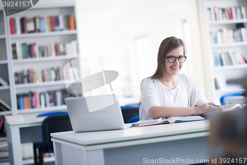 Image of female student study in school library