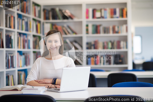 Image of female student study in school library