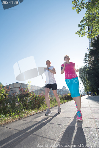 Image of female friends jogging
