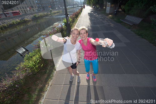 Image of female friends jogging