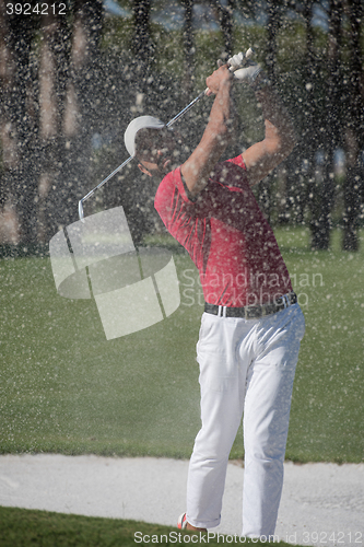 Image of golfer hitting a sand bunker shot