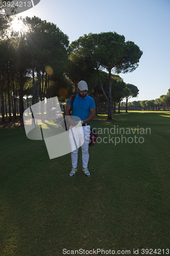 Image of golf player walking