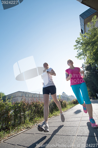 Image of female friends jogging