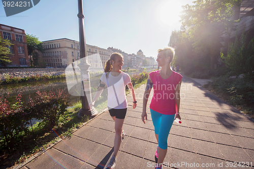 Image of female friends jogging