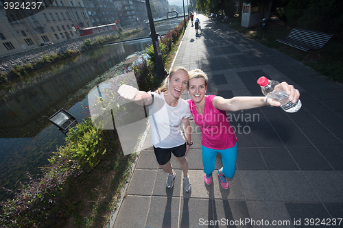 Image of female friends jogging