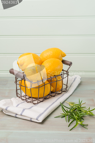 Image of Lemons in a old wire basket