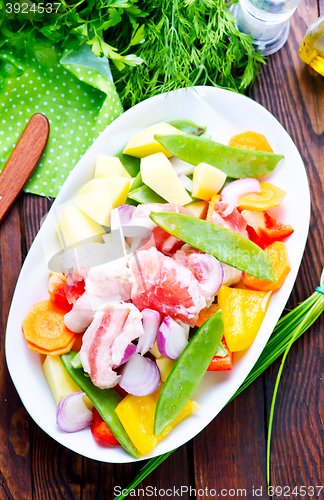 Image of raw meat with vegetables