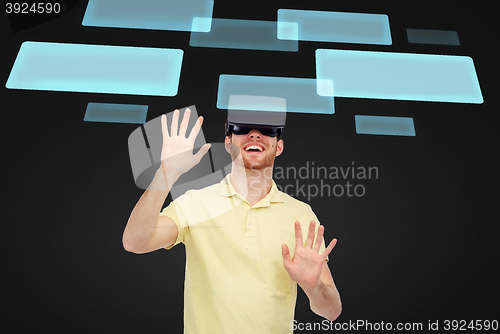 Image of happy man in virtual reality headset or 3d glasses