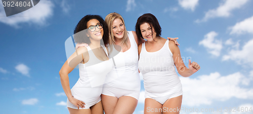 Image of group of happy plus size women in white underwear