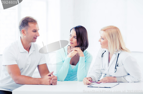 Image of doctor with patients in cabinet