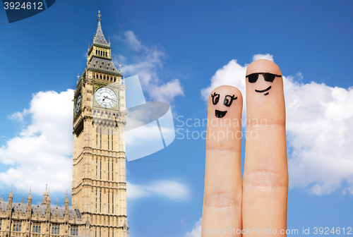 Image of close up of two fingers with smiley faces