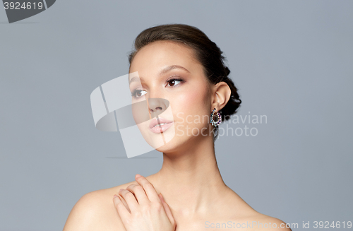 Image of close up of beautiful woman face with earring