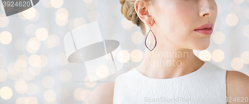 Image of close up of beautiful woman face with earring