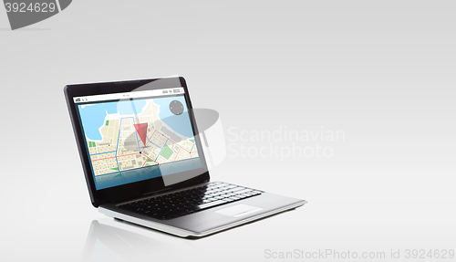 Image of laptop computer with gps navigator map on screen