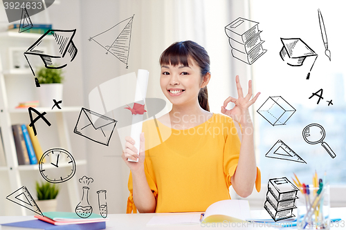 Image of happy asian woman student with diploma at home