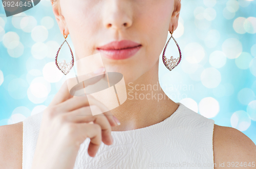 Image of close up of beautiful woman face with earrings