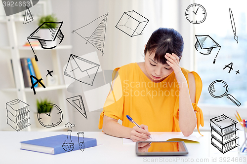 Image of bored asian woman student with tablet pc at home