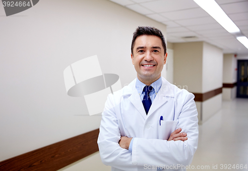 Image of smiling doctor at hospital corridor