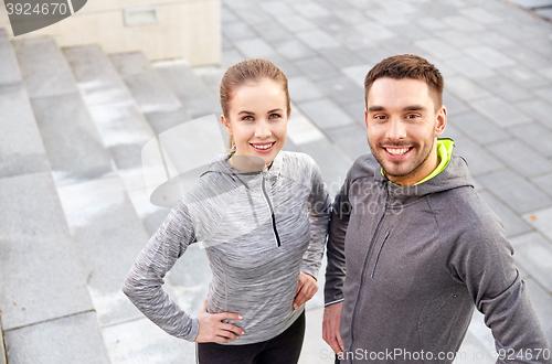 Image of smiling couple outdoors on city street