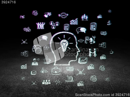 Image of Business concept: Head With Lightbulb in grunge dark room