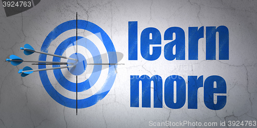 Image of Learning concept: target and Learn More on wall background