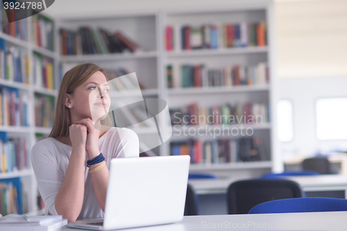 Image of female student study in school library