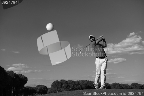 Image of golf player hitting long shot