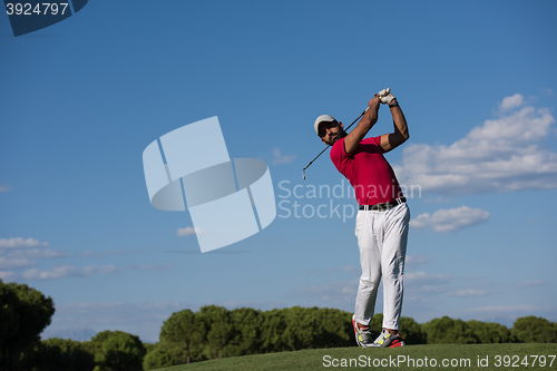 Image of golf player hitting long shot