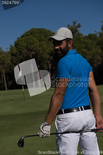 Image of golf player portrait from back