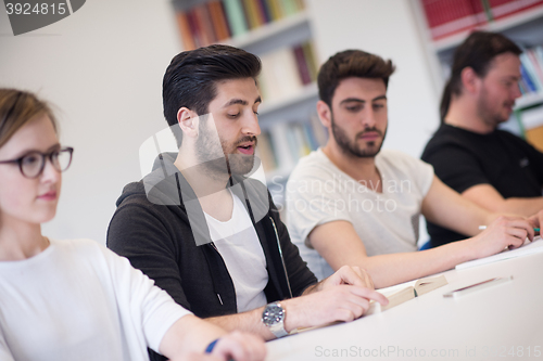 Image of group of students study together in classroom