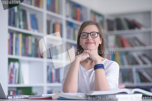 Image of female student study in school library