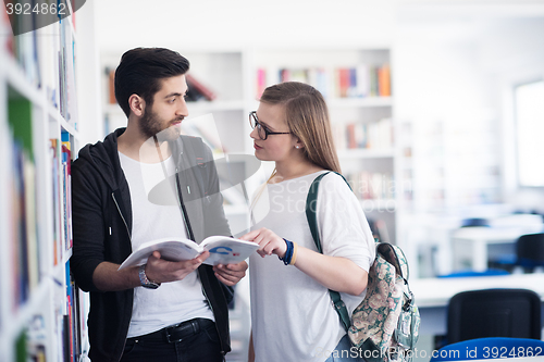 Image of students couple  in school  library