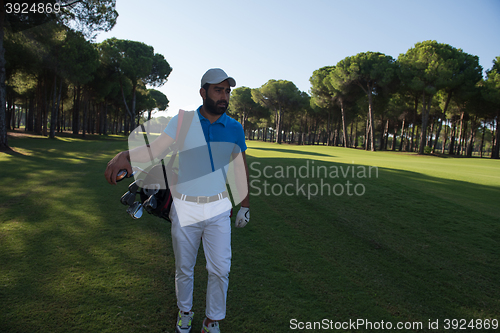 Image of golf player walking