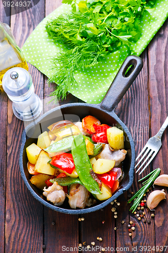 Image of fried meat with vegetables