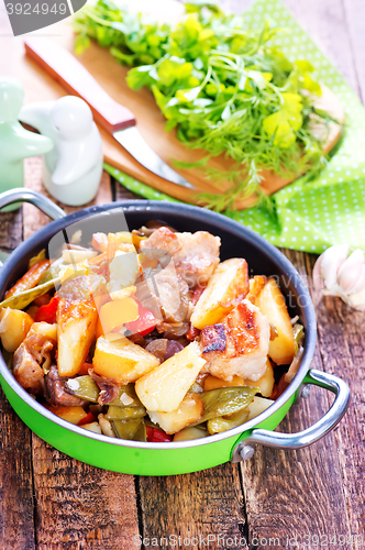 Image of fried meat with vegetables