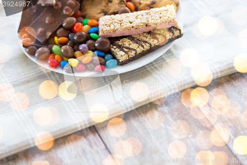 Image of close up of candies, chocolate, muesli and cookies