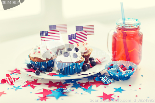 Image of cupcakes with american flags on independence day